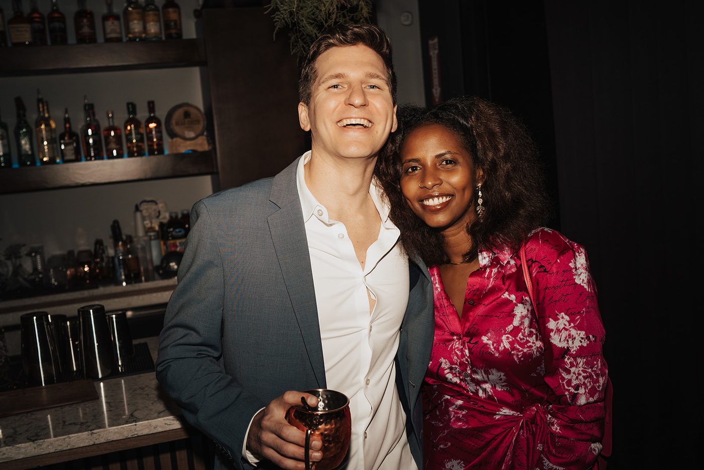 Two guests smiling together at the gala