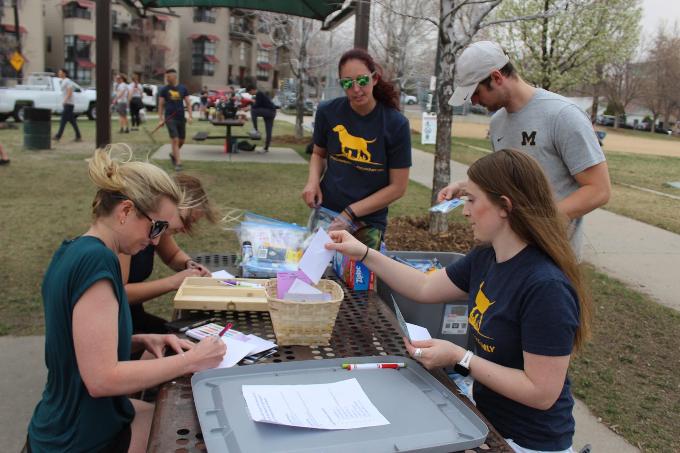 Volunteers packing hygiene bags on Earth Day at Hirshorn Park