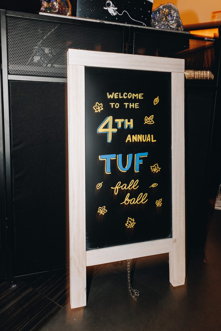 A chalkboard sign reading Welcome to the 4th Annual TUF Fall Ball