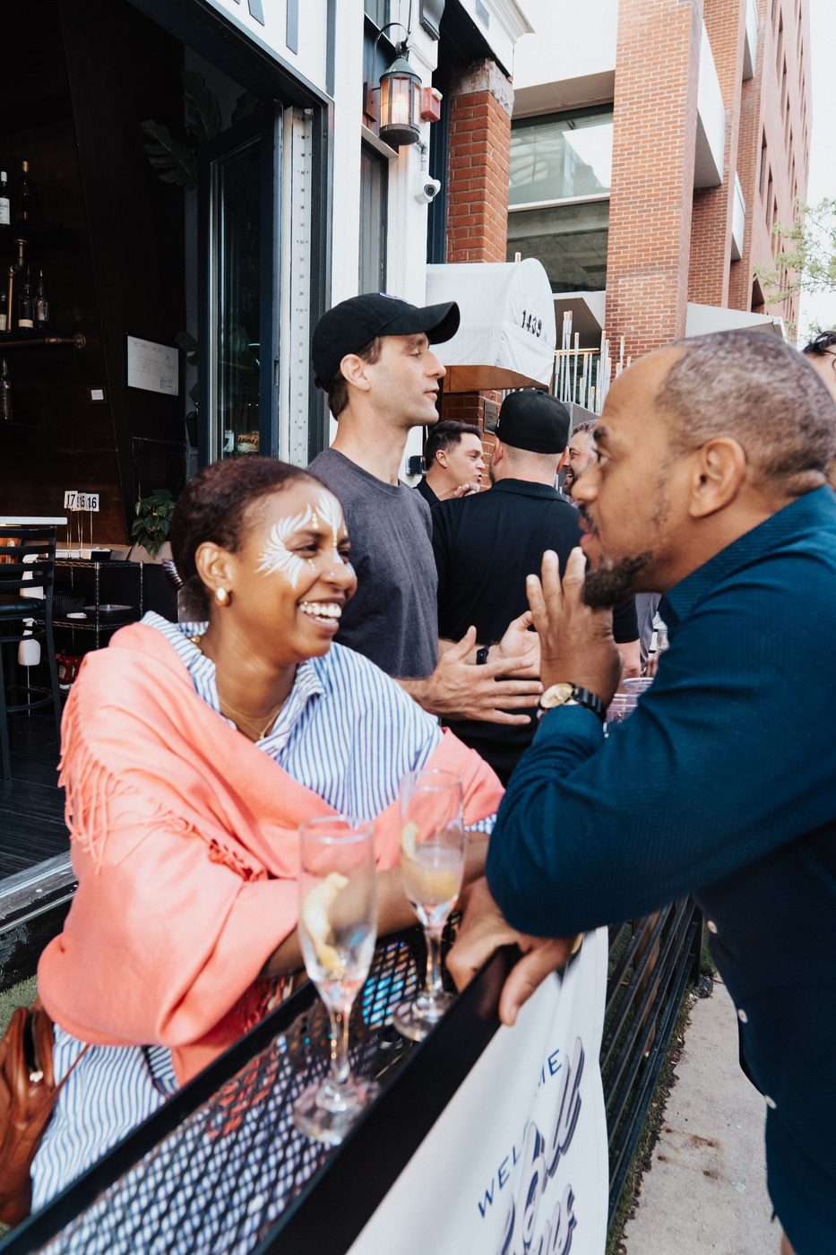 Guests laughing together on the patio