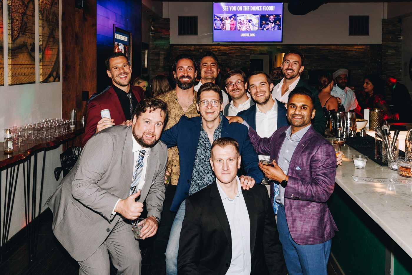 A large group of guests from all walks of life together at the Fall Ball