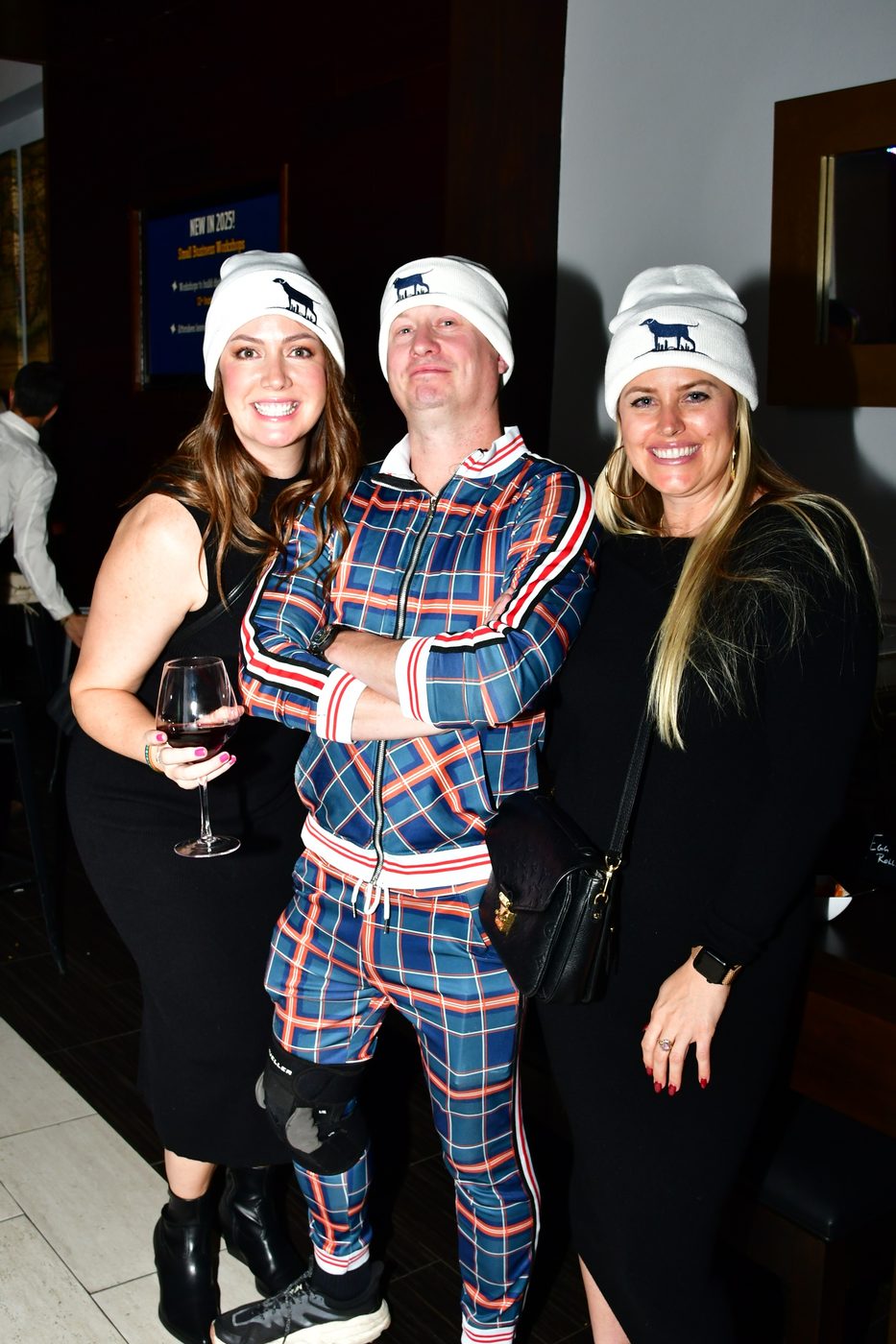 Three guests wearing white TUF beanies at Fall Ball