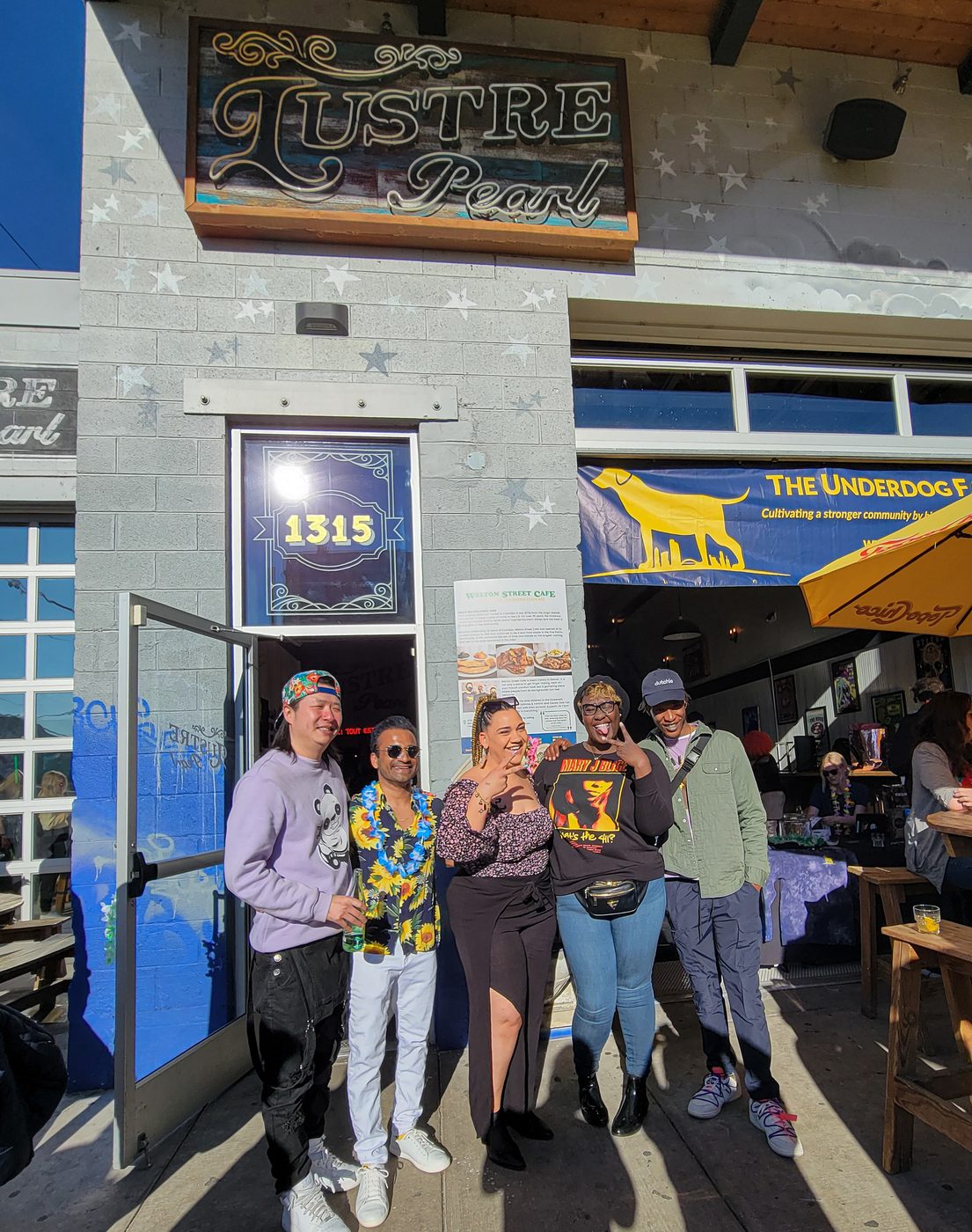 Group outside Lustre Pearl under the marquee