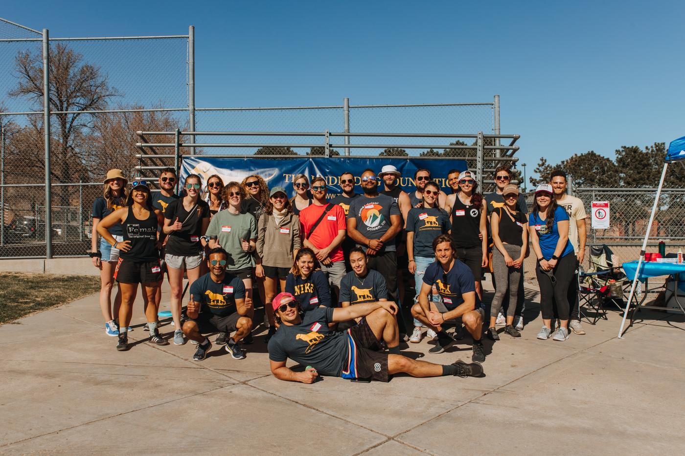 A large group of Underdog Family volunteers at a community day at Hirshorn Park in Denver