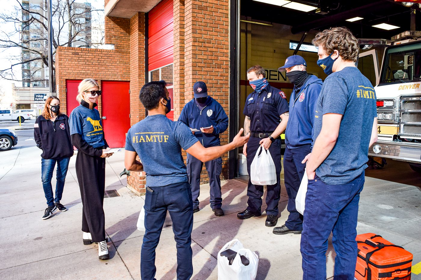 The team delivering a meal donation to Denver firefighters with Genna Rae's Wings