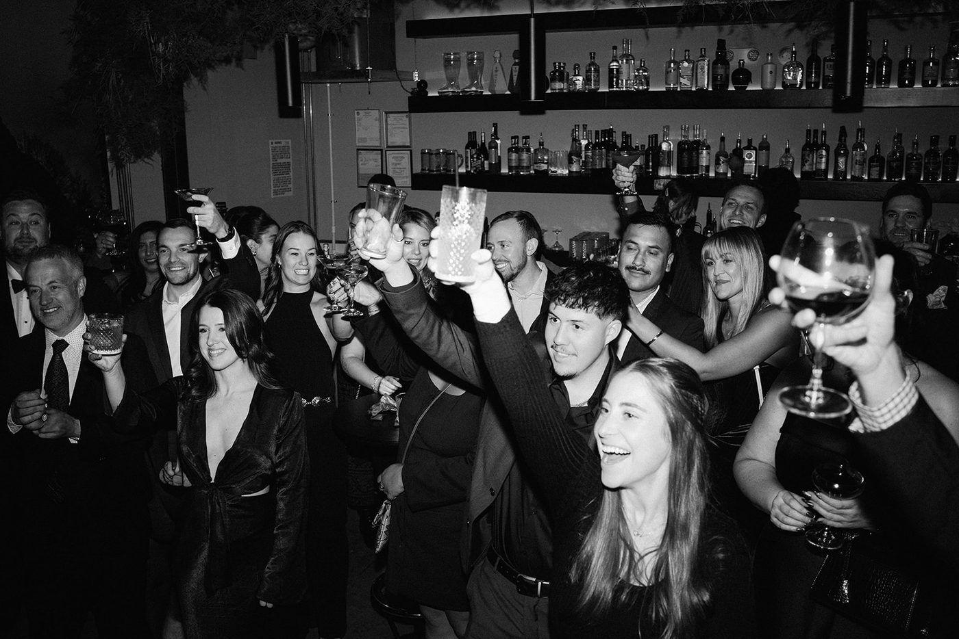 The whole room raising a toast at the gala