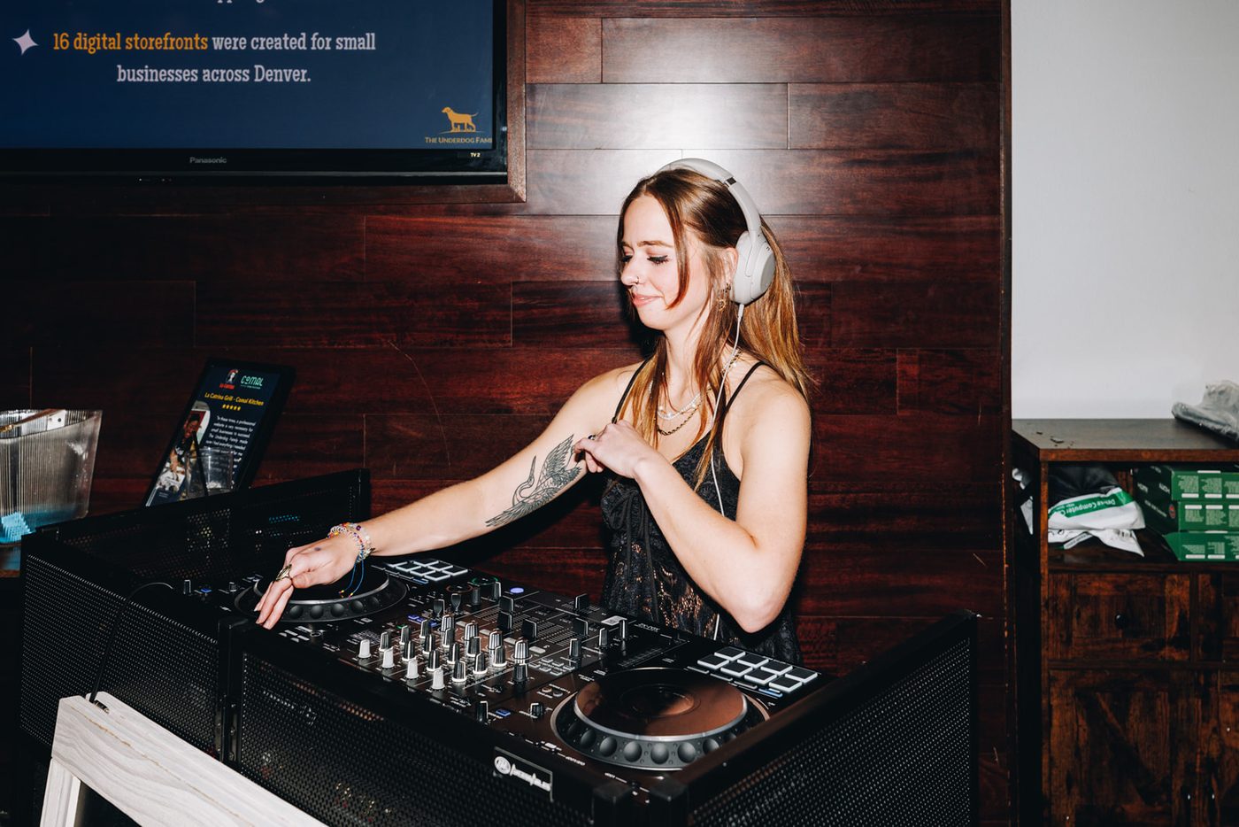 The DJ smiling behind the decks at Fall Ball