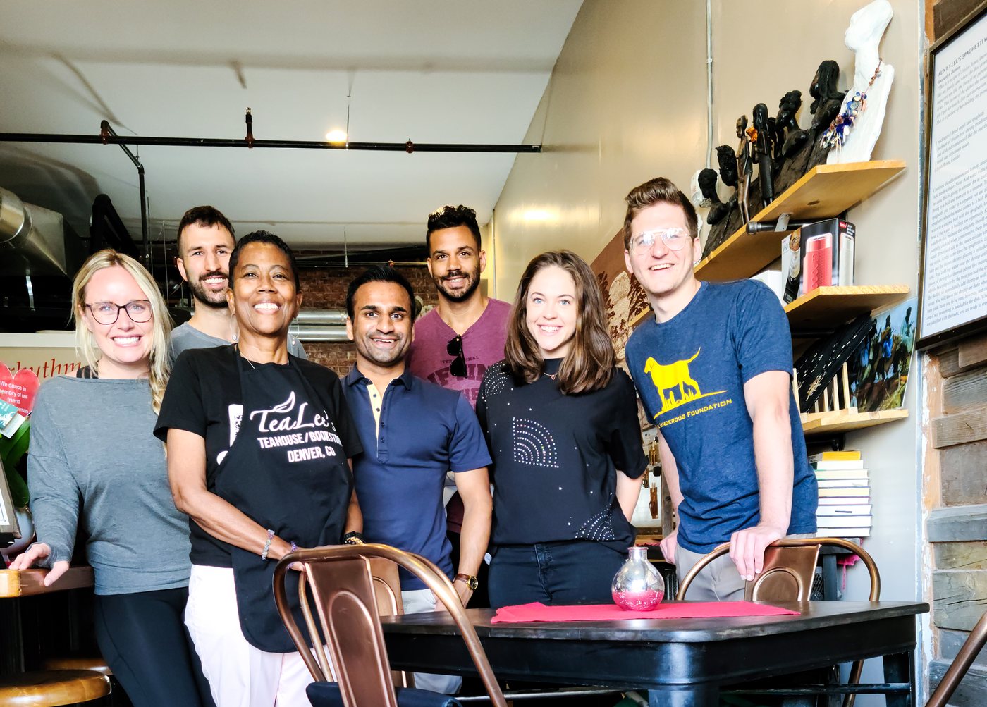 The crew with the owner of TeaLee's Teahouse in Five Points