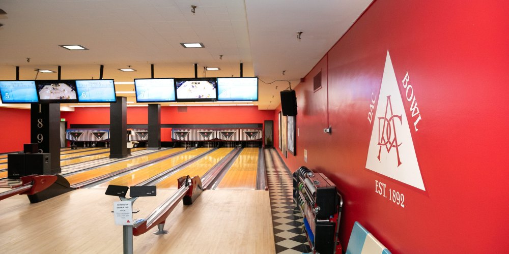 The DAC Bowl bowling alley with red walls and polished lanes